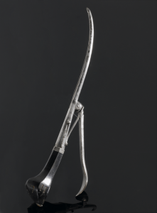 A picture containing black, dark, holding, lamp

Description automatically generated